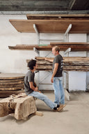 Junto founders Zé Maria and Bernardo discussing the dialogue between technical drawing and raw timber