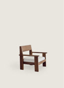 Custom furniture Alba Lounge Chair by Juntowd featuring wide arms and a comfortable upholstered seat for outdoor use.