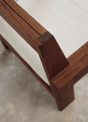 etailed view of the handcrafted solid wood joinery and wide armrests on the Juntowd Alba custom furniture lounge chair.