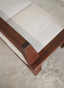 Detailed view of the architectural clarity and solid wood joinery on the Juntowd Alba outdoor sofa.