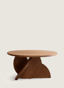 Side profile of the Bloom Table by JUNTO, showing the expressive motion of its custom furniture architectural base.