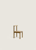 A standalone custom furniture Experience 1 Chair in Portuguese Walnut, acting as a sculptural side chair for modern interiors.