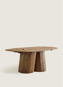 Architectural profile of the Juntowd Palma Table, showing the tension of its crossing cylindrical legs and bespoke wood frame.