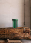 Handcrafted solid wood Trio Stool in a modern entryway, showcasing its functional and graphic silhouette.
