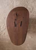 Top view of the Matiz Coffee Table in Portuguese Walnut, showing the natural wood grain and precise rounded silhouette of this bespoke furniture piece
