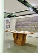 The Palma Dining Table by JUNTO, a bespoke furniture masterpiece exhibited at Novo Banco’s award-winning art gallery.